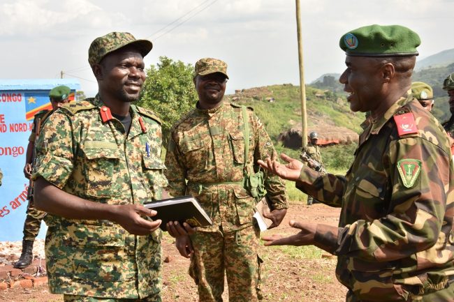Brig Gen Kasango Maloba Roberts (right) FARDC Commander Beni Sector interact with UPDF Col Dennis Wandera Wanyama (left) Commanding Sector 3 (1)