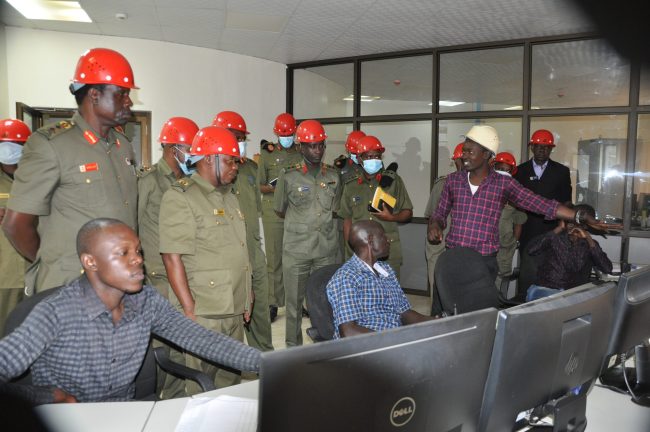Assistant manager of Tororo cement plant Mr. Olema Ronald briefing Senior UPDF students from the National Defence College – Uganda on a study tour on 20th June 2022