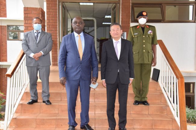Hon MoDVA Vincent Ssempijja in a group photo with the UN Specilal Envoy for the Great Lakes Region H.E Xia Huang to his left and the CDF Gen Wilson Mbadi to his extreme left