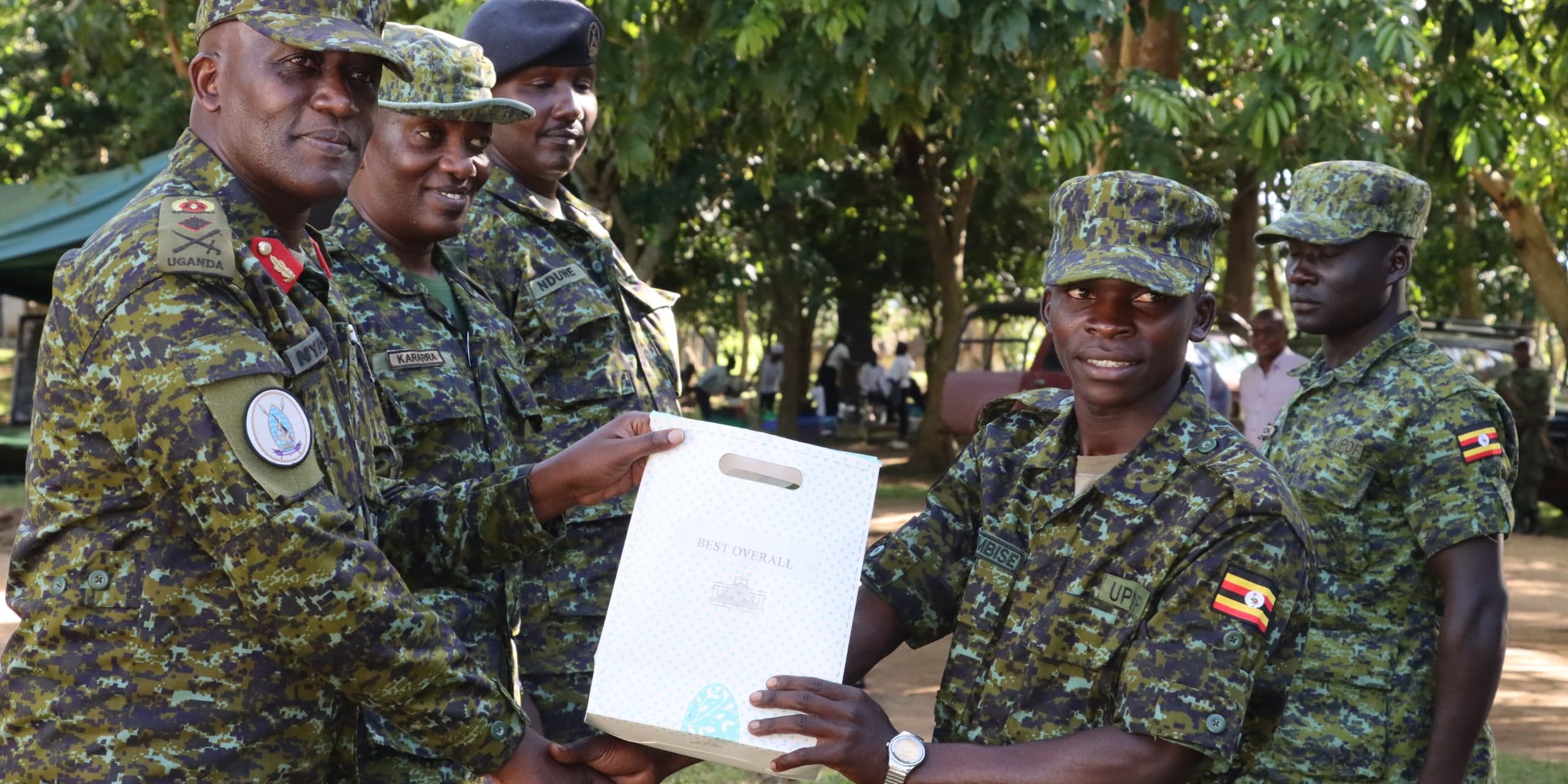 Brig Gen Michael Nyarwa Awarding a prize to the best student Pte Tumuhimbise Aaron