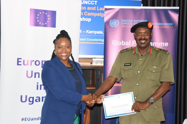 Col Alex Tumushabe being a warded a certificate of Complition by Ms Sylivia Kabaki Acting Head of UN office of Counter Terrorrism-Nairobi
