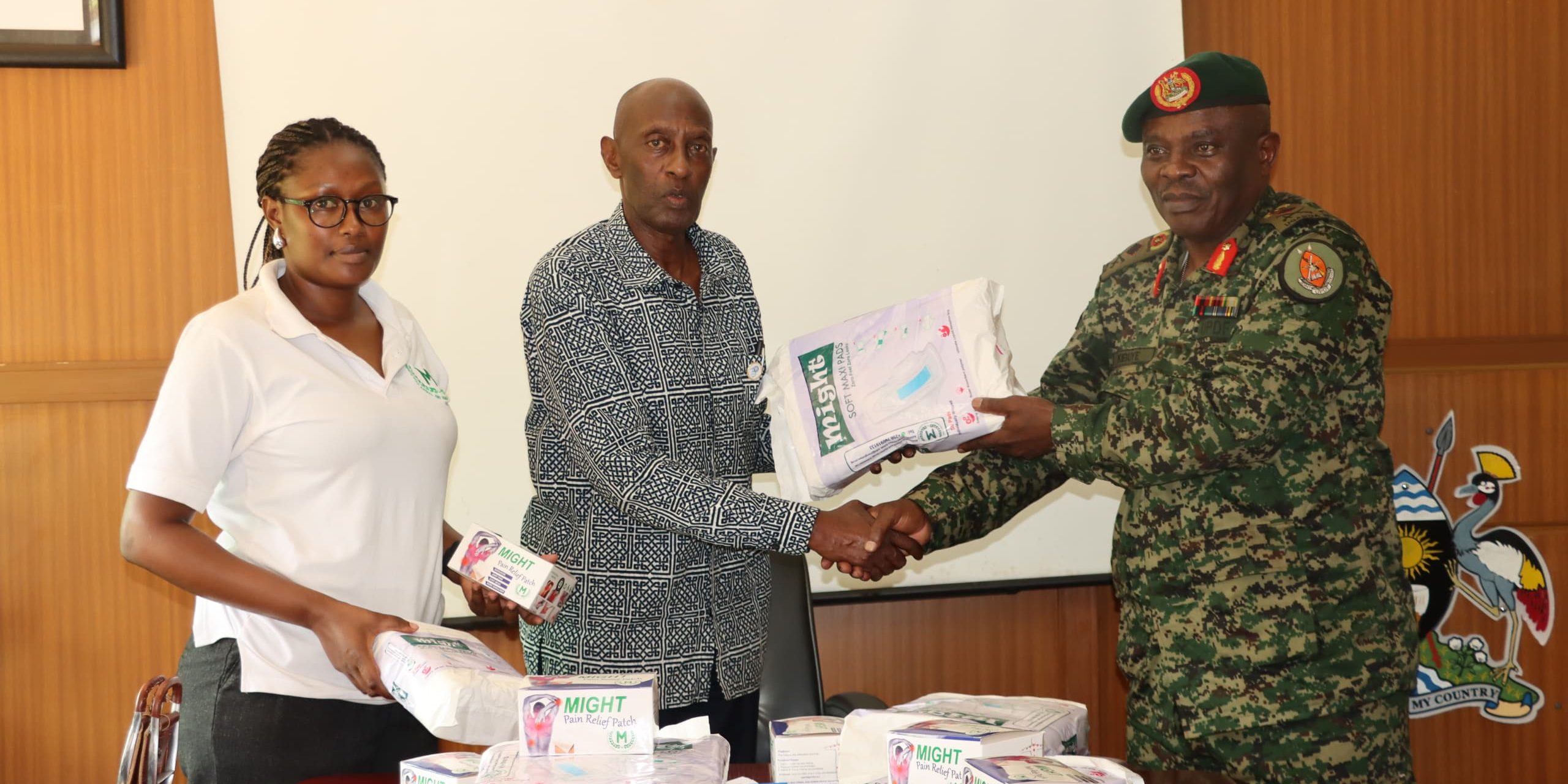 Bri Gen Micheal Kibuye reciving might pain relif patach and pads from Rtd Brid Gen Emmanuel Rwashande at MODVA Hq