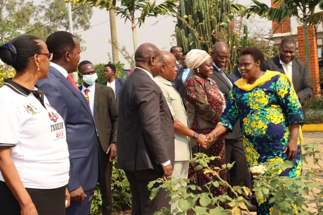 H.E. Jessica Alupo shakes hands with Gen Hon Wilson Mbadi as other ministers, Hon Wilson Kajwengye and Permanent Secretary Mrs. Rosette Byengoma look on