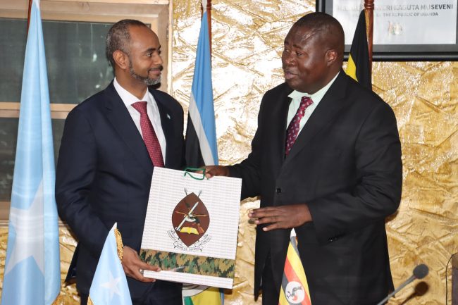 Minister Jacob Oboth Oboth gifts his Somali counterpart