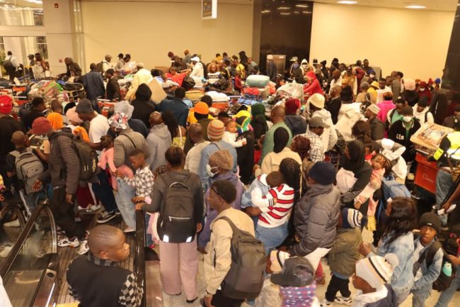 some of the second batch returnees from south africa at the Entebbe International Airport during their arrival.JPG