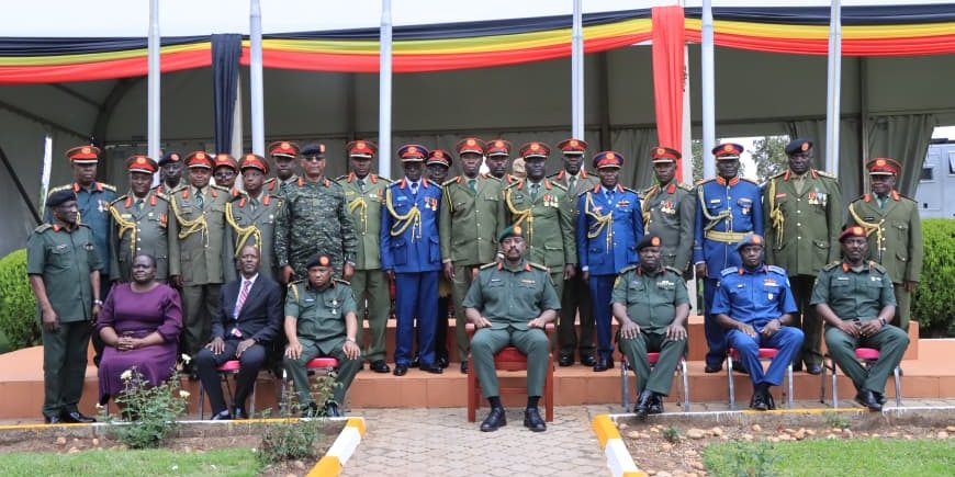 Chief Of Defence Forces sharing a group photo with retirees after retirement ceremony at Modva Hqs Mbuya.JPG
