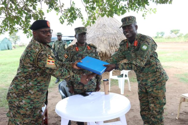 Col adnan Handing over office files to the incoming, Col Mukasa.JPG