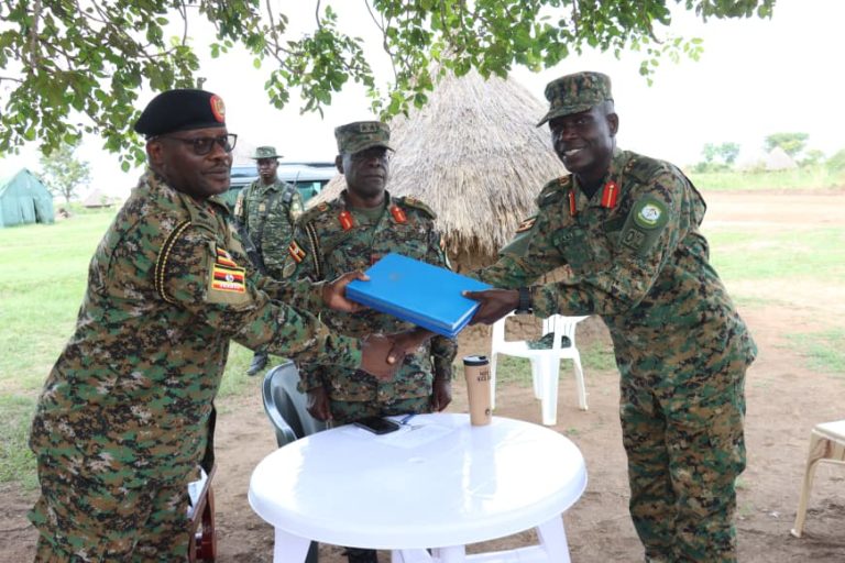 Col adnan Handing over office files to the incoming, Col Mukasa.JPG