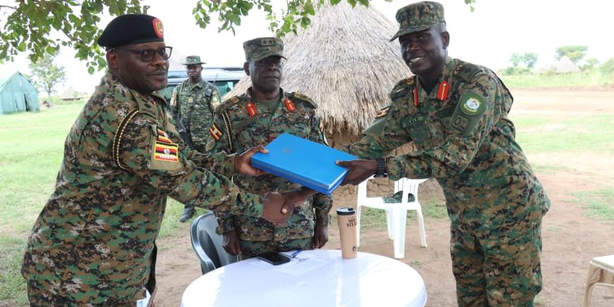 Col adnan Handing over office files to the incoming, Col Mukasa.JPG