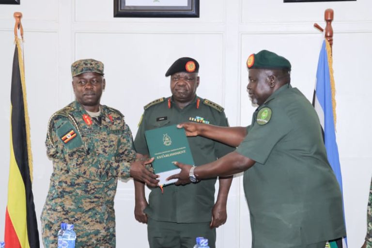Lt Gen Otema hands over Instruments of Power to Maj Gen Ssemwanga.jpg