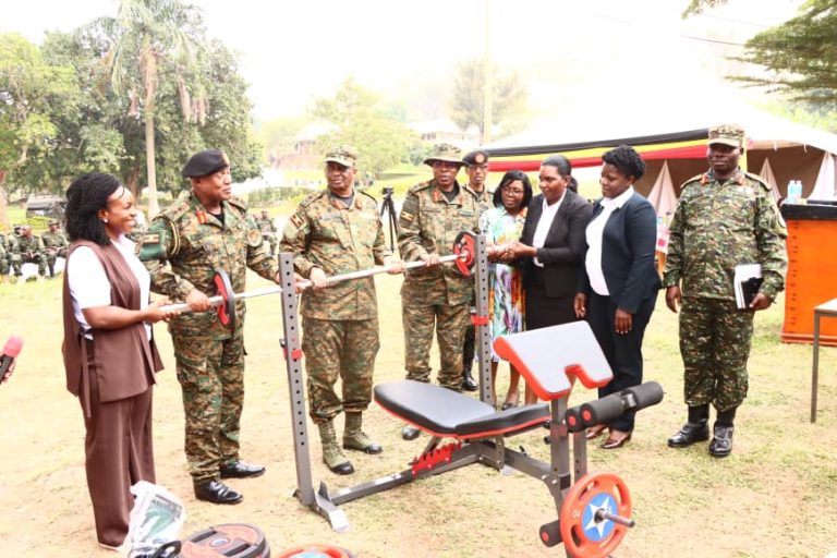 Maj Gen Henry Masiko, Maj Gen Richard Karemire ,Brig Gen Moses Kwikiriza and other UPDF Officials recieve donations of sports items .JPG