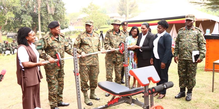 Maj Gen Henry Masiko, Maj Gen Richard Karemire ,Brig Gen Moses Kwikiriza and other UPDF Officials recieve donations of sports items .JPG