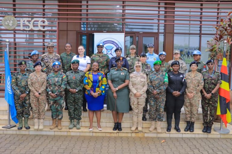Brig Gen Charity in a group photo with course participants and their instructors.jpg