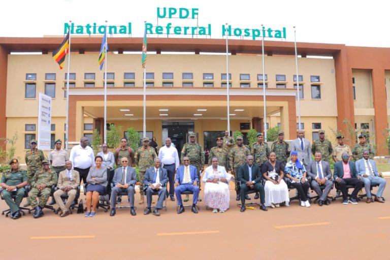 Hon Kiryowa Kiwanuka in agroup photo with Defence parliamentary Committe and board members of UPDF NRH.jpg