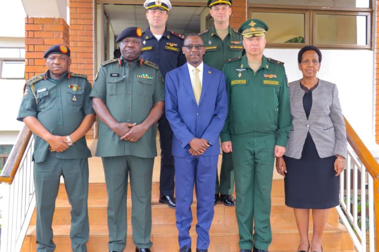 Hon Kiryowa Kiwanuka(C) in agroup photo with russian Delegation, Modva and Updf at MoDVA hqrs.jpg
