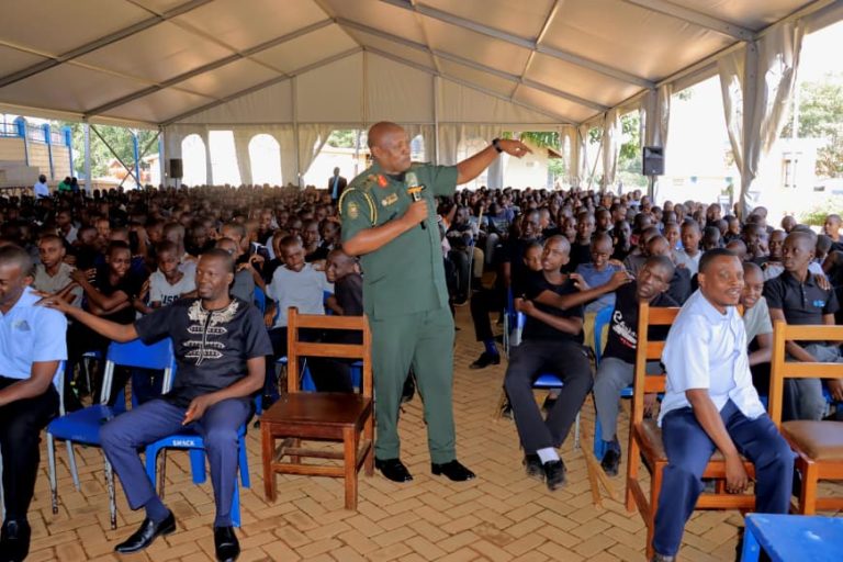 Maj Gen Henry Masiko JS Political Commisser giving his remarks to the student of SMACK Kisubi.JPG