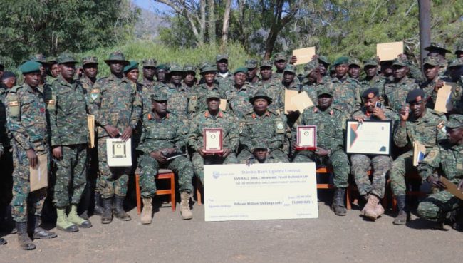 The 3DIV Comd. Brig Gen. Hyeroba in a group photo with the participants.JPG