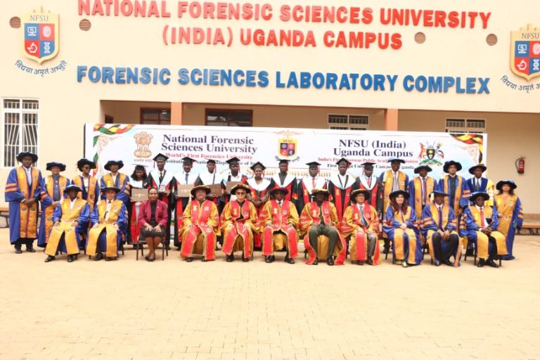 The Chief guest Hon Kiryowa Kiwanuka (Sitting in the centre) in a group photo with Graduands.JPG