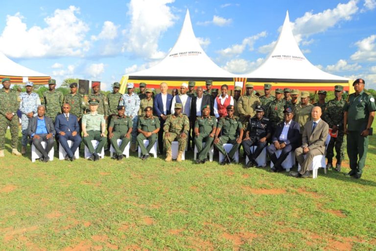 A group photo moment with the Chief guest Maj Gen Joseph Semwanga speaking at the pass out ceremony of advanced Arabic and Chinese languages course at migyera.JPG