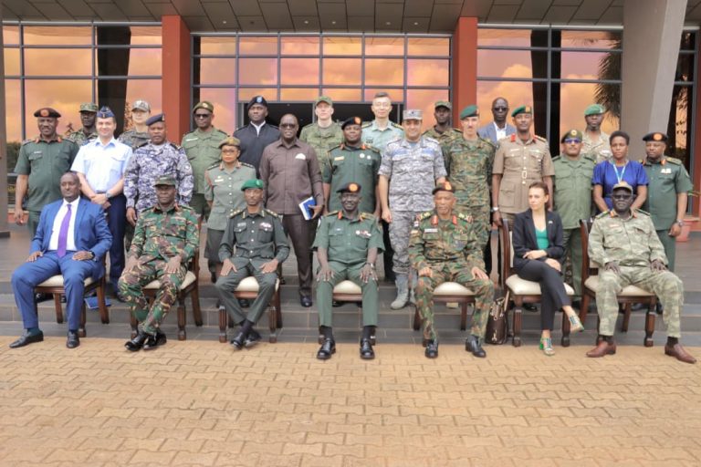 Maj Gen Richard Otto ( Middle) with other chiefs after the meeting held at Mbuya 2