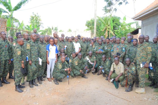 Photo opportunity taken in the field after Touring three projects of Paultry, Piggery and Coffee farming in central buganda.JPG