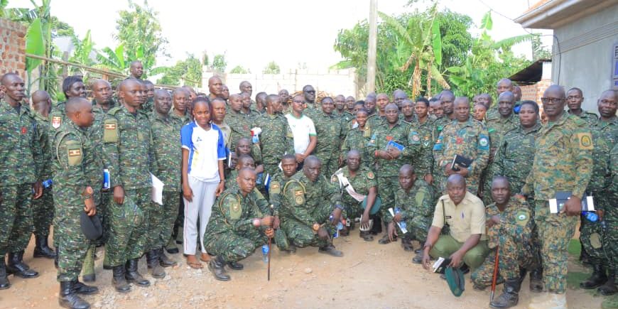 Photo opportunity taken in the field after Touring three projects of Paultry, Piggery and Coffee farming in central buganda.JPG